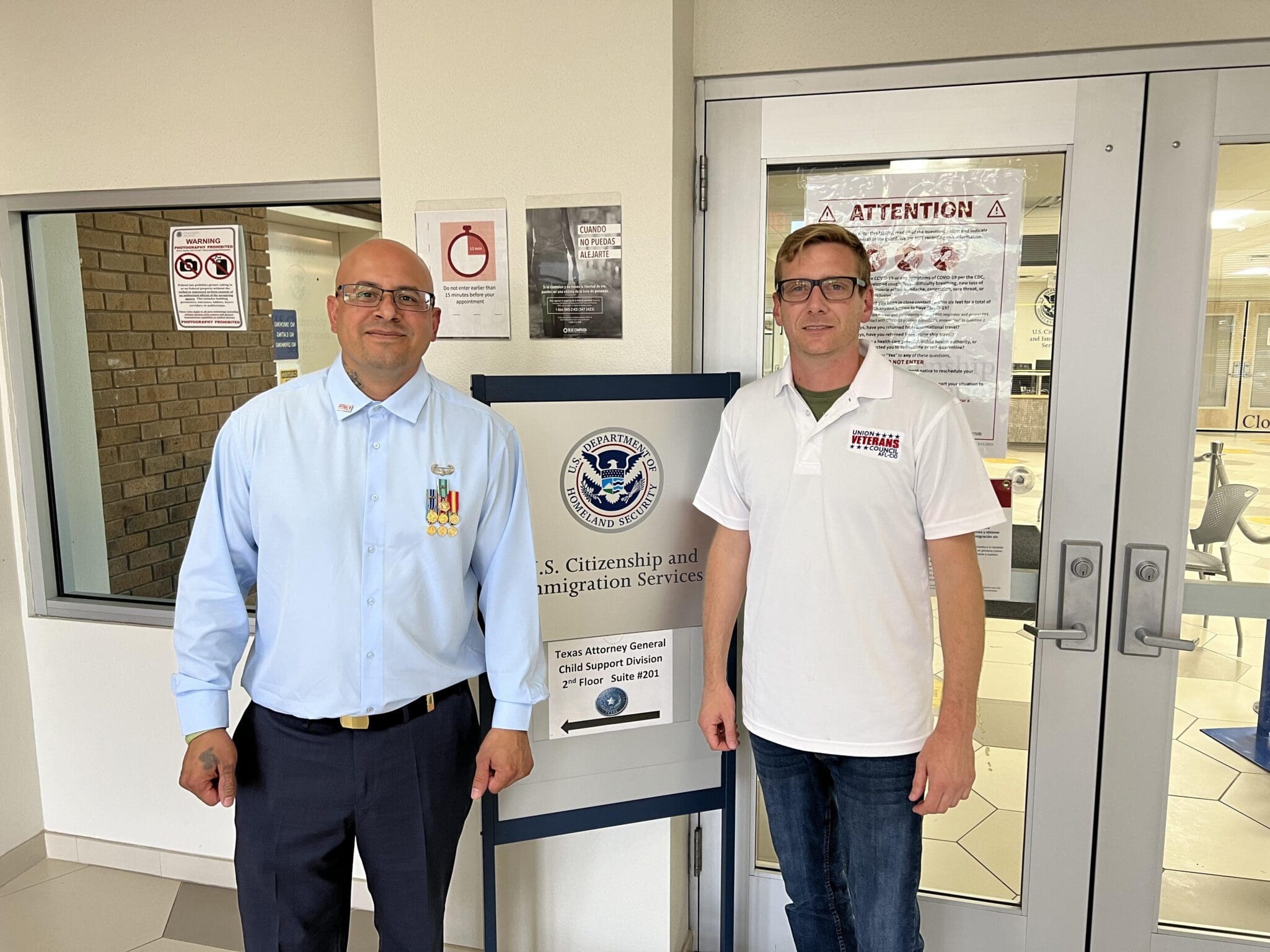 Ivan Ocon, a deported Army veteran, stands on the left. Will Attig, executive director of the Union Veterans Council, AFL-CIO, stands to the right.